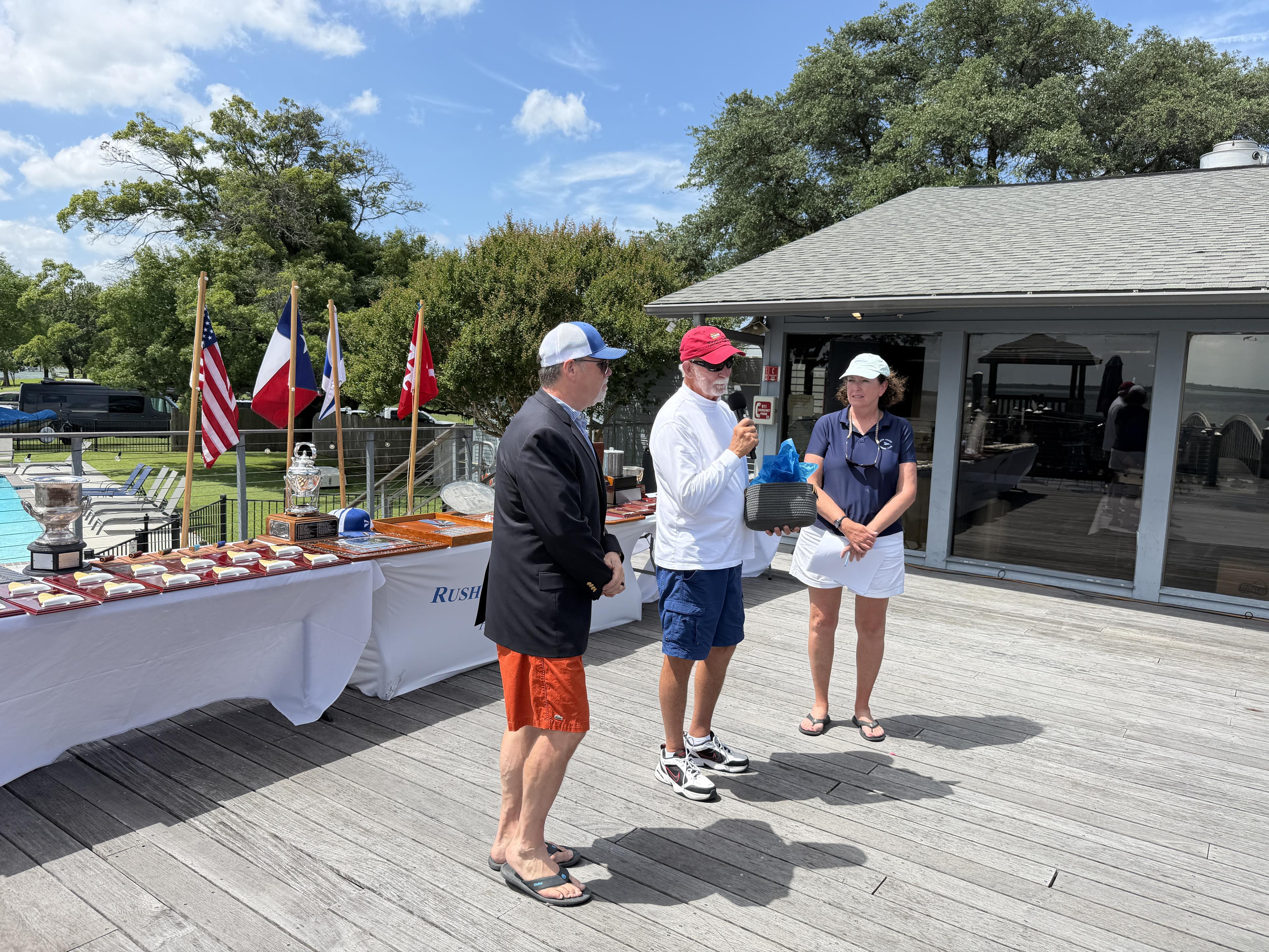 Regatta award ceremony with sailors and race officer at Rush Creek Yacht Club